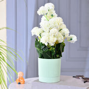 White Faux Plant in Lined Plastic Pot